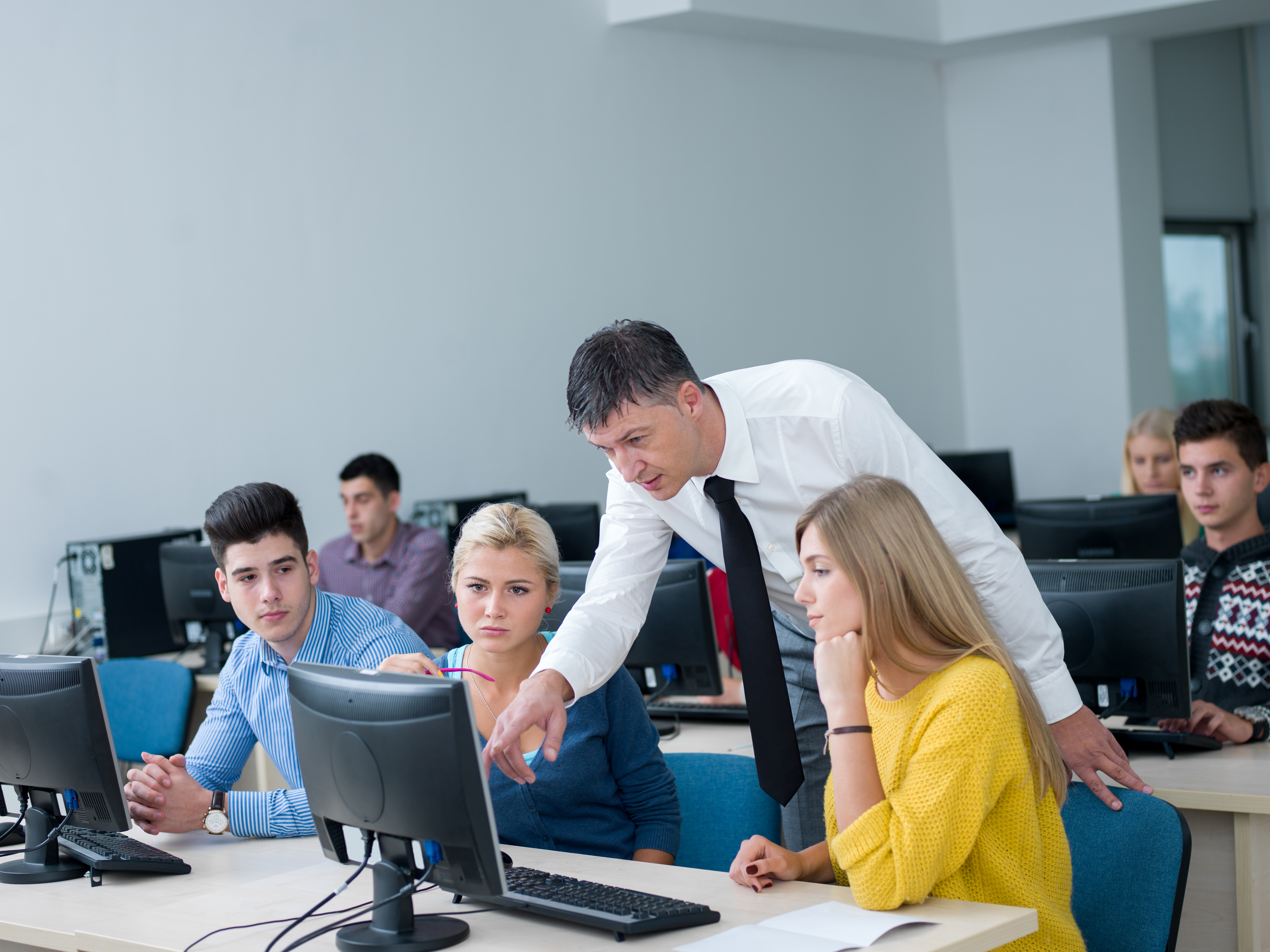 group-of-students-with-teacher-in-computer-lab